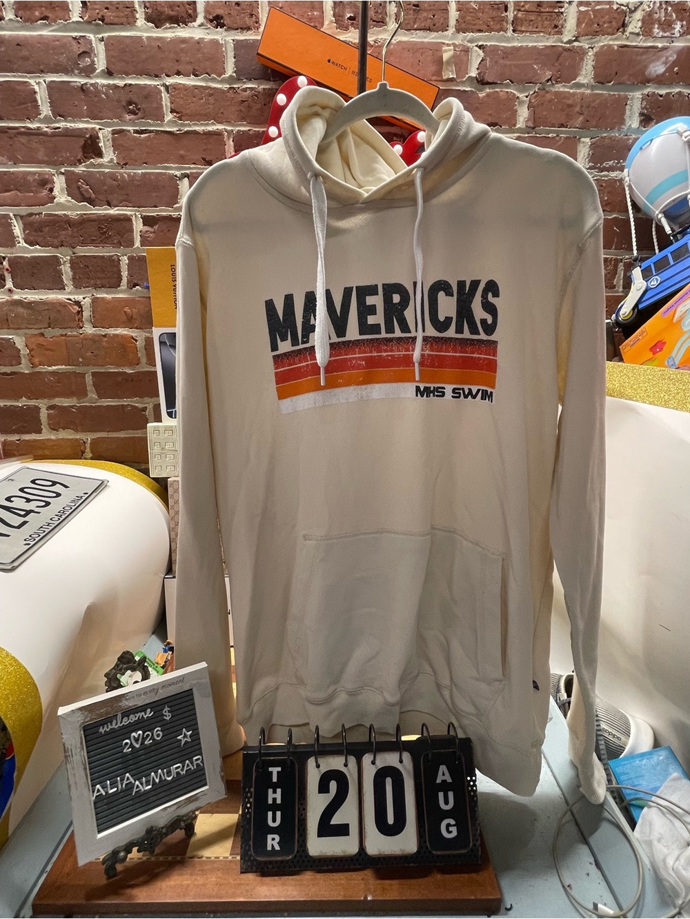 Mavericks MHS Swim" pullover hoodie featuring a retro 1970s-style